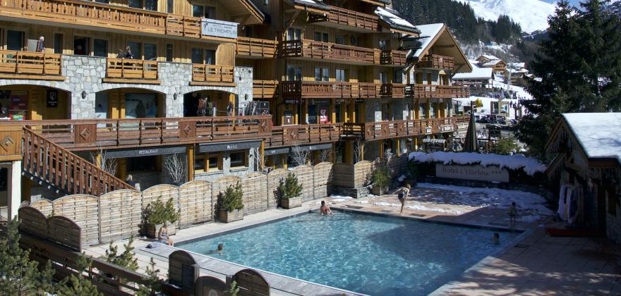 Our outdoor pool: the magic of swimming beneath the snow-capped peaks of Méribel